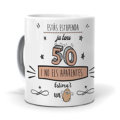 Consigue ahora Mundohuevo Taza Regalo 50 cumpleaños Mujer en Catalan Ja Ideas para regalar tens 50 i no ELS aparentes. Ceramica AAA - 350 ml. Top Precio 2024 | regaloscumple.com